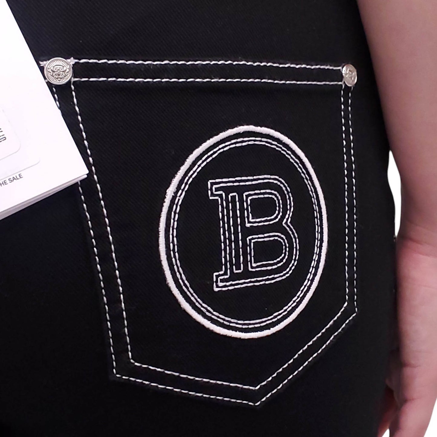 BALMAIN BLACK DENIM PANTS WITH WHITE STITCHING - SIZE 42