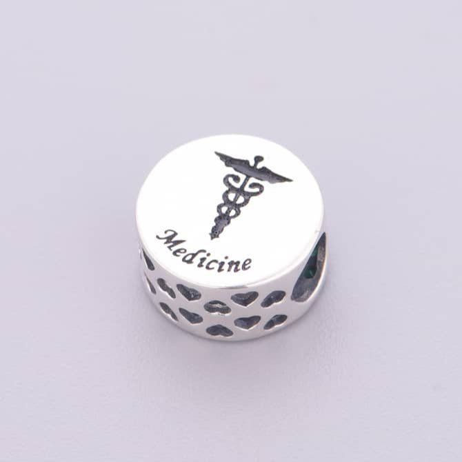 Medicine Symbol with Green Crystal Charm